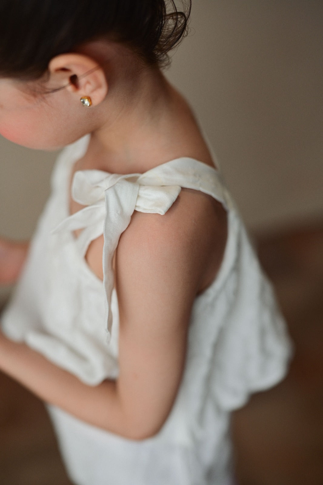 Textured white Top with Bow Strapes
