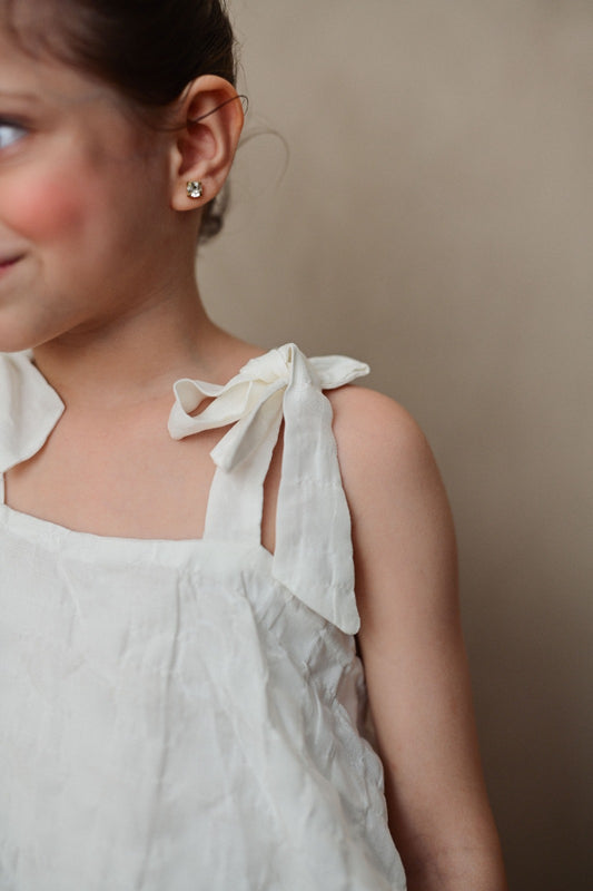 Textured white Top with Bow Strapes